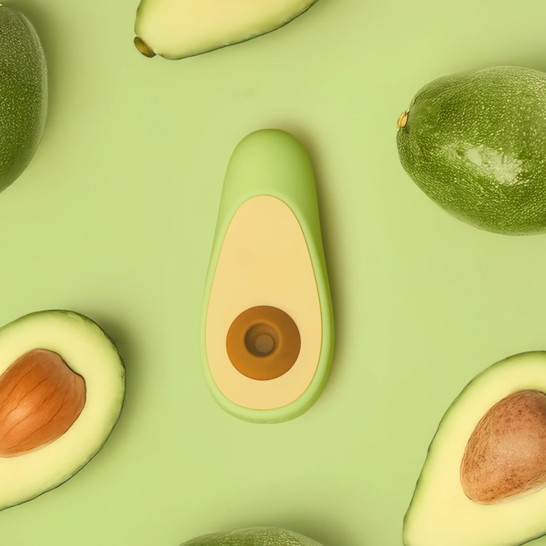 Hello Nancy avocado-form product arranged among avocados on a green ground